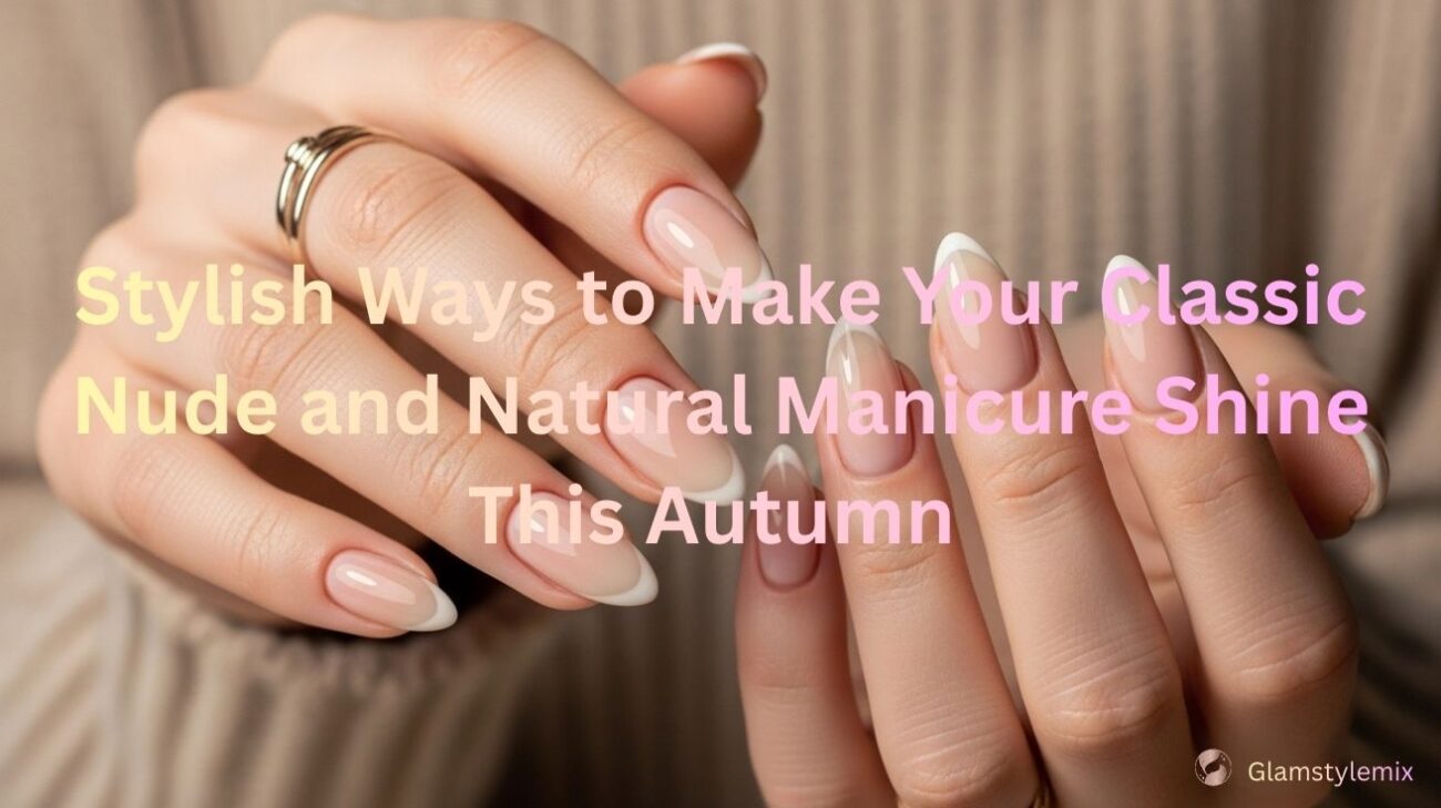 Hands with a nude and natural manicure featuring soft beige and light pink tones, shaped in almond style, with subtle French-inspired detailing, shown against a cozy neutral sweater background.